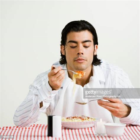 Asian Man Eating Spoon Photos And Premium High Res Pictures Getty Images