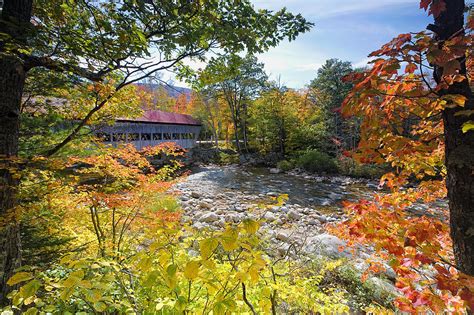 View Of A Covered Bridge Through Colorful Fall Foliage Photograph By