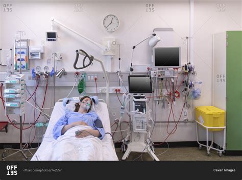 High Angle View Of Female Patient Sleeping On Bed In Hospital Stock