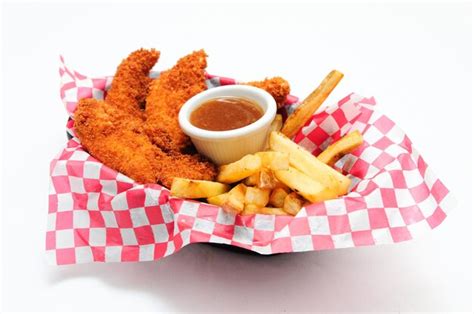 Premium Photo Breaded Chicken Strips With French Fries And Dipping