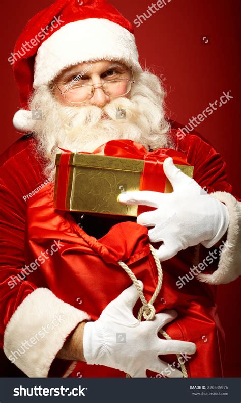 Portrait Of Happy Santa Claus Holding Big Sack With Presents Stock