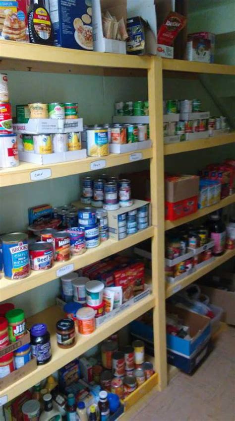 Food pantry volunteers work to stock shelves in food storage room. Second Baptist Church - Food Pantry
