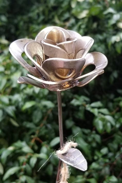 Single rose cut out metal wall art indoor / outdoor decor. This is a single handmade rose made from recycled washers and wire. Each rose is an individual ...