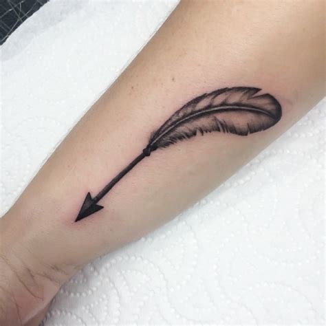Feather and arrow on forearms. 57 Attractive Wrist Feather Tattoos