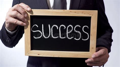 Success Written On Blackboard Businessman Holding Sign Business