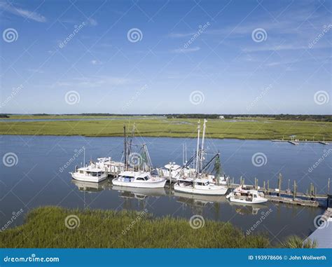 Low Aerial View Of Shrimp Boats In Port In Folly Beach South Carolina