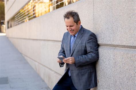 Middle Aged Handsome Businessman Using Mobile Phone App Sending Message