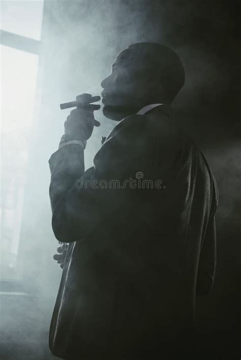 African American Businessman In Suit Smoking Cigar Stock Photo Image