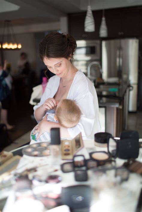 this stunning wedding photo captures bride and her bridesmaids breastfeeding together