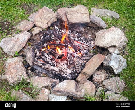 campfire burning burning fire fireplace stones holiday meadow from above camping