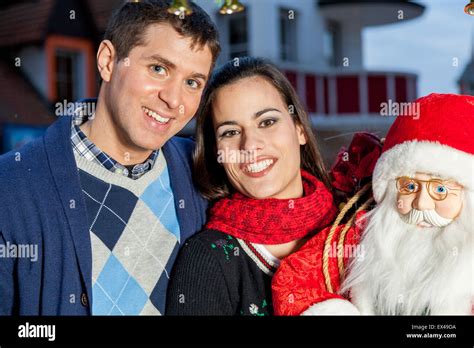 Couple celebrating Christmas Stock Photo - Alamy