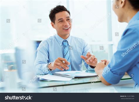 Managers Discussing Business Ideas During Meeting Stock Photo 212317489