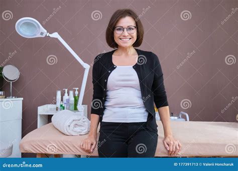 Beautiful Smiling Mature Woman Client Of Beauty Salon Posing Looking At Camera Stock Image