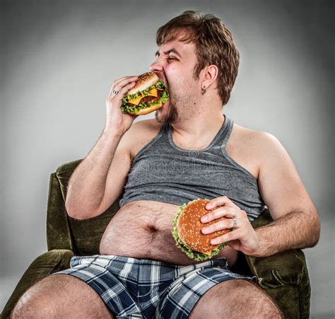 Fat Man Eating Hamburger Stock Photo Image Of Drink