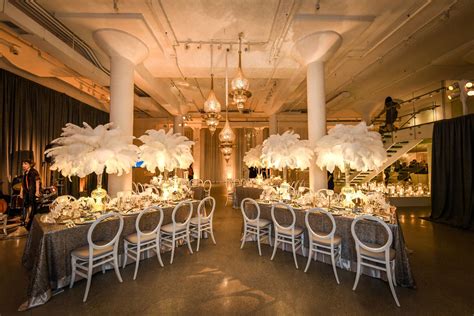 1920s Themed Wedding Reception With Tall White Feather Centerpieces