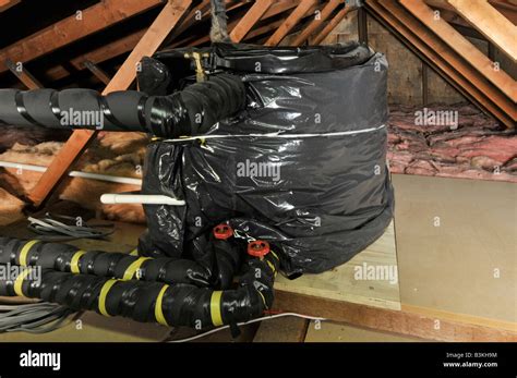 Domestic Dwelling Loft Roof Space With Lagging To Pipes And Cold Stock