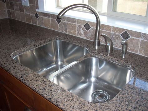 This kitchen sink faucet is designed to mount into a single hole system but an escutcheon is included for multiple hole sinks. Best Material For Kitchen Sink - HomesFeed