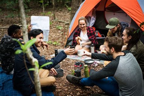 Premium Photo Friends Camping In The Forest Together