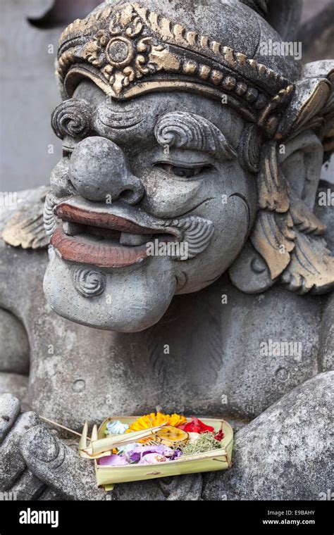 Canang Sari Balinese Hindu Offering On Temple Statue Ubud Bali