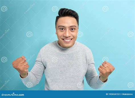Young Confident Asian Man In Eyeglasses Joyfully Showing Yes Gesture On