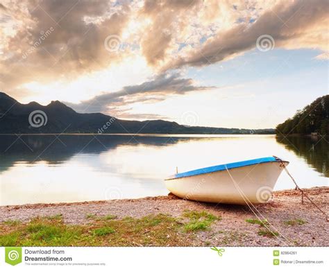 Abandoned White Paddle Boat On Alps Lake Bank Evening Lake Stock Image