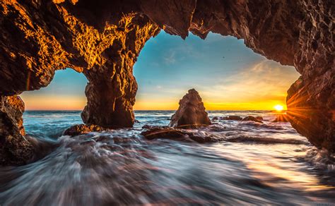 Malibu Sea Cave Sunset Red And Orange Clouds Seascape Ocean