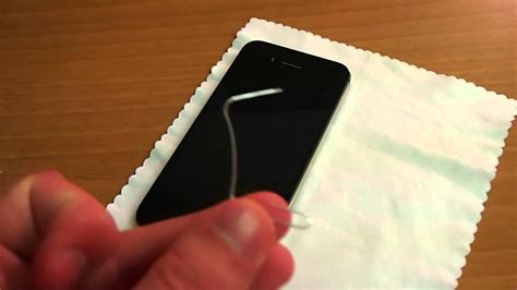 If the tray is stuck take a really thin paper clip and a pair of pliers and make a little hook that will still thread through the hole but you can angle it to catch on the back side and try to pull the sim tray out manually. How To Remove an iPhone 4/4S SIM Card - YouTube