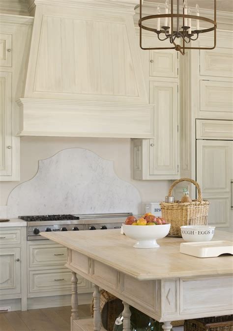 These gorgeous pulls are a little bit rustic, a little bit glamorous. White Washed Kitchen Cabinets - French - kitchen - Phoebe Howard