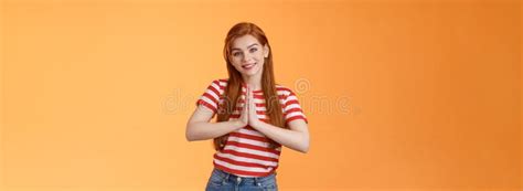 tender lovely redhead girl acting like angel nun making innocent kind expression smiling cute