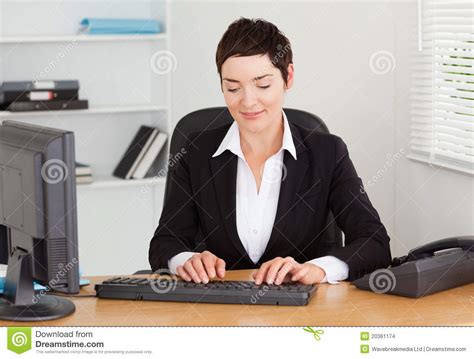 Secretary Typing On Her Keybord Stock Images - Image: 20361174