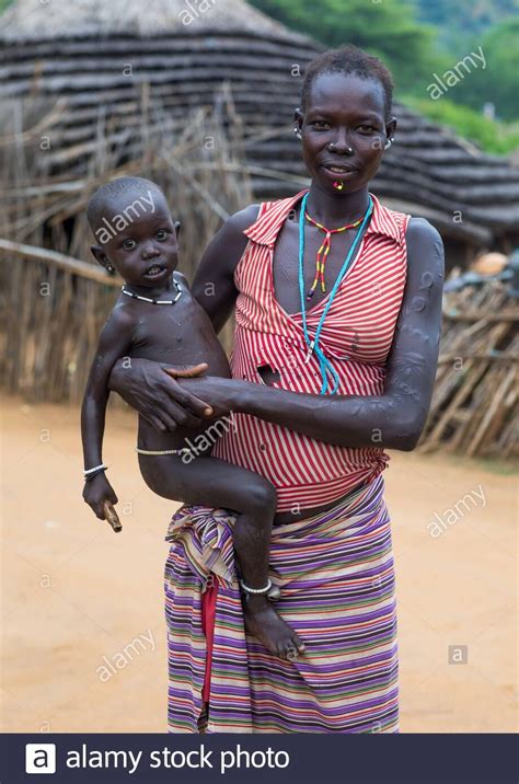 Download This Stock Image Portrait Of A Larim Tribe Mother Carrying