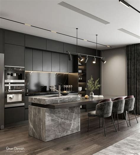 A Modern Kitchen With Marble Counter Tops And Stainless Steel Appliances