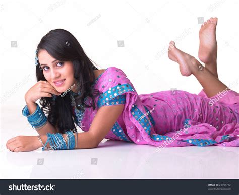 Indian Girl Lying On Floor Lifting Foto Stock 23095732 Shutterstock