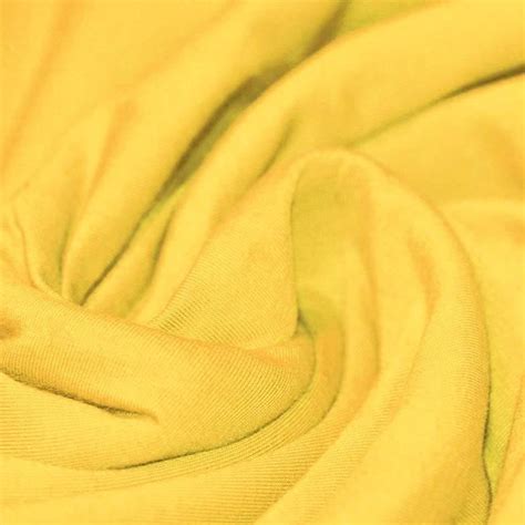 It is a circular knitted fabric. Tissu coton jersey jaune pas cher. 50 couleurs au mètre!