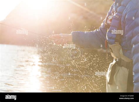 Angler Fishing With His Orvis Fly Reel Stock Photo - Alamy