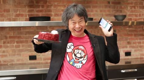 Shigeru Miyamoto Plays Super Mario Run While Eating Cake