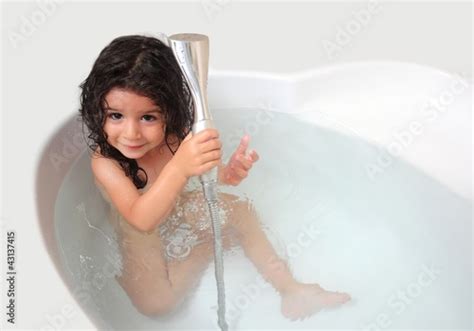 Baby Girl Is Taking Shower In The Bathtub Stock Photo And Royalty Free Images On Fotolia Com