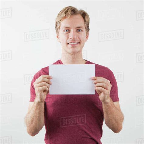 Man Holding Blank Paper Sheet Stock Photo Dissolve