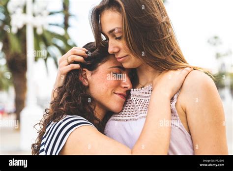 Two Young Girls Embracing Hi Res Stock Photography And Images Alamy