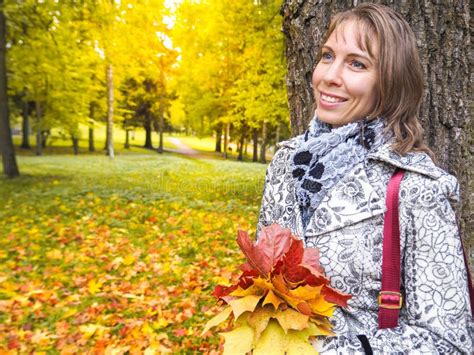 Beautiful Woman In Autumn Park Woman In Autumn Park With Colorful