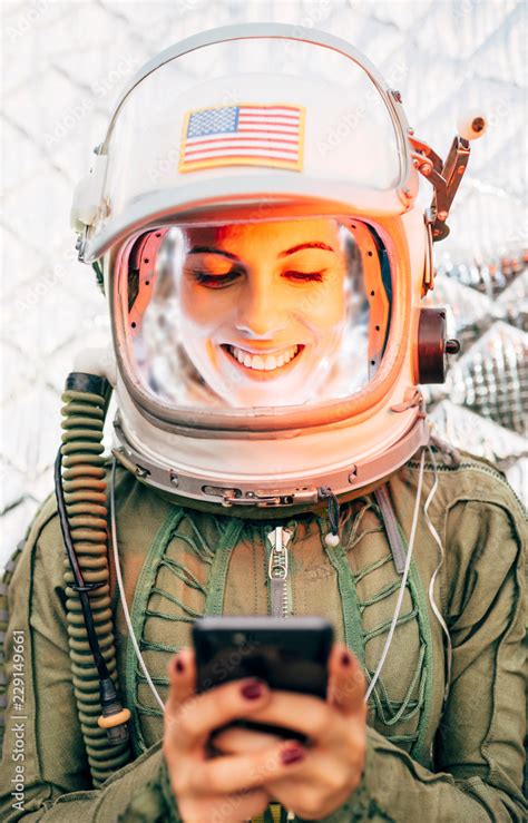 Beautiful Female Astronaut With Mobile Phone Stock Photo Adobe Stock