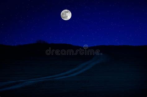 Scenic Night Landscape Of Country Road At Night With Large Moon Stock