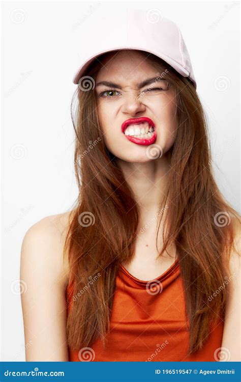 Portrait Of A Woman In A Cap Cheeky Look Grimace Model Attractive Stock