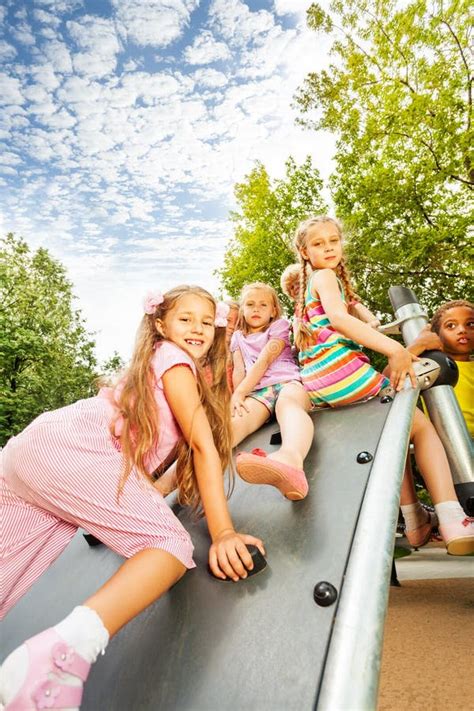 Girl Climbs On Playground Construction And Mates Stock Image Image Of Holding Legs 43168045