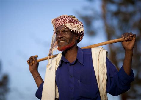Deserts are hot and dry. Wako, Borana chieftain with a stick on the shoulders - Ken ...