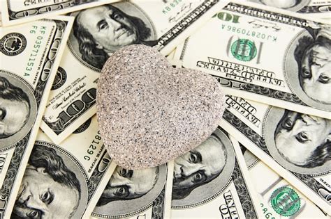 Premium Photo Love And Money Concept Heart Shaped Stone And American