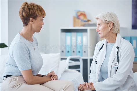 Doctor Consulting Woman Patient For Healthcare Clinic Services And