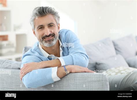 45 Year Old Man Relaxing In Sofa At Home Stock Photo Alamy