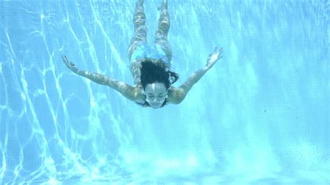 girl swimming underwater in swimming pool stock footage sbv 308642434 storyblocks