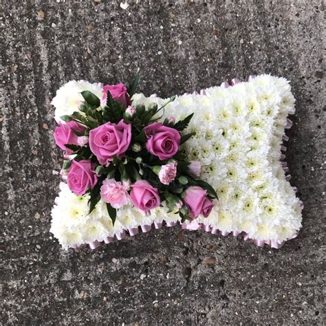 White Based Pillow Funeral Flowers Tribute With Pale Pink Rose Focal